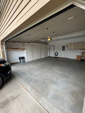 Pagosa Springs house for rent - an empty garage with a car parked in it