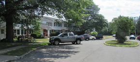 Massena apartment for rent - a street with cars parked in front of a house