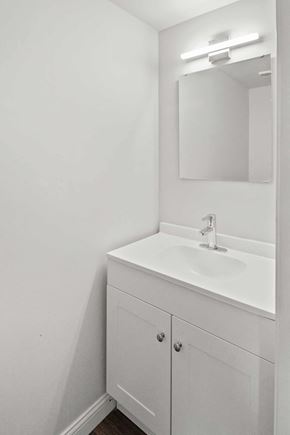 Louisville apartment for rent - A white bathroom vanity with a sink and mirror.