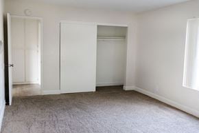 Anaheim apartment for rent - A room with white walls and carpeted floor.