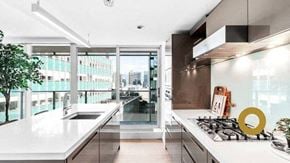 Vancouver house for rent - a kitchen with a sink and a stove and a window