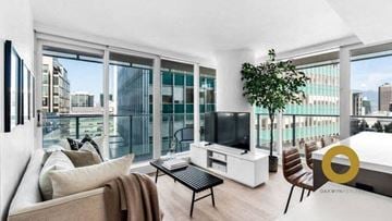 Vancouver house for rent - a living room with a couch and a television