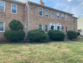 Collingswood apartment for rent - A brick building with a white door and windows.