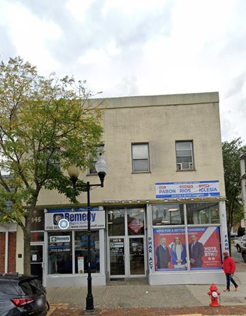 Perth Amboy apartment for rent - a building with a red fire hydrant in front of it