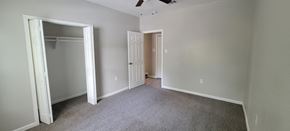Sweeny house for rent - an empty bedroom with a closet and a door to the bathroom