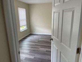 Cartersville house for rent - A room with a white door and a window.
