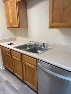 Cartersville house for rent - A kitchen with a sink and wooden cabinets.
