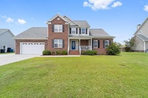 Jacksonville house for rent - A large house with a brick facade and a blue door.