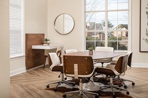 Robinsonville apartment for rent - A conference room with a white desk and brown chairs.