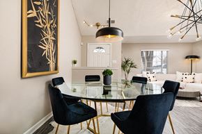 Horn Lake triplex for rent - a dining room with a glass table and chairs