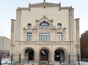 Chicago apartment for rent - the front of a building with windows and a fence