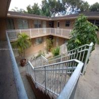 Homestead apartment for rent - an apartment building with a balcony and a balcony railing