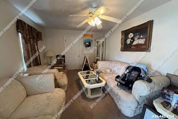 St. Louis house for rent - a living room with furniture and a ceiling fan