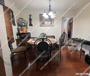 St. Louis house for rent - a dining room with a table and chairs