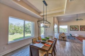 Horseshoe Bay house for rent - a dining room with a table and chairs and a large window