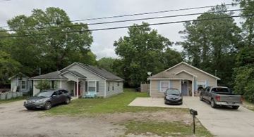 St Augustine house for rent - Two houses with cars parked in front.