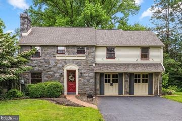 Wilmington house for rent - A house with a red door and a stone chimney.