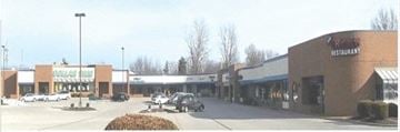 St. Peters apartment for rent - an old photo of a shopping center with cars parked in the parking lot