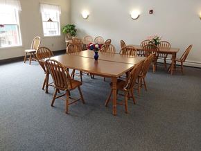 Oil City apartment for rent - a large dining room with a wooden table and chairs