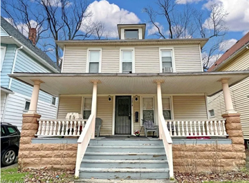 Cleveland house for rent - the front of a house with stairs and a porch