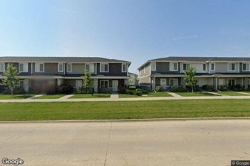 Waukee apartment for rent - a row of houses on the side of a street