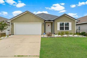 Southport house for rent - a house with a driveway and a garage door