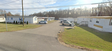 Batesville apartment for rent - a row of mobile homes on the side of a street