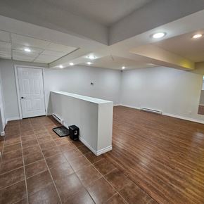 Sault Ste. Marie house for rent - a living room with a partitioned wall and a wooden floor
