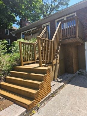 Sault Ste. Marie house for rent - a pair of wooden stairs in front of a house