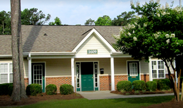 Tarboro apartment for rent - a house with a green door and a tree in front of it