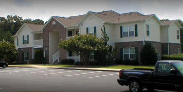 Goldsboro apartment for rent - a building with a truck parked in front of it