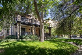 Denver apartment for rent - a house with trees and grass in front of it