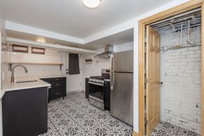 Denver apartment for rent - a kitchen with a sink and a stove and a refrigerator