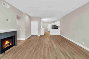 Aliso Viejo apartment for rent - a living room with a fireplace and a hard wood floor