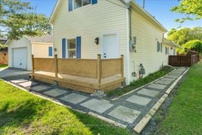 Trenton, Quinte West apartment for rent - A house with a wooden fence and a white door.