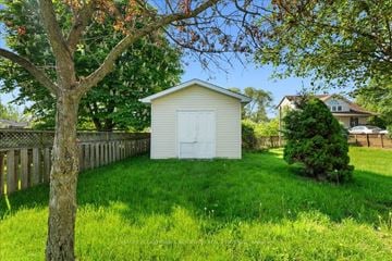 Trenton, Quinte West apartment for rent - A small white shed sits in a grassy yard.