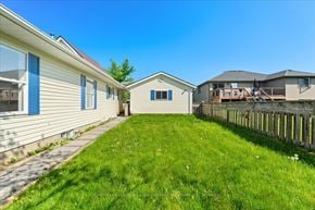Trenton, Quinte West apartment for rent - A sunny day at a residential area with houses and green lawns.