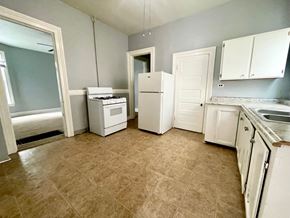 Louisville apartment for rent - an empty kitchen with a stove refrigerator and sink