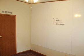 Trinidad house for rent - a white wall with a scripture on it in a room