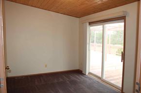 Trinidad house for rent - an empty living room with a sliding glass door