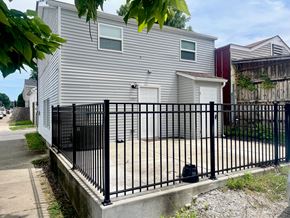 Louisville apartment for rent - a white house with a black fence in front of it