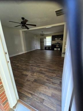 Mt. Sterling house for rent - a living room with a wood floor and a ceiling fan