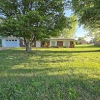 Mt. Sterling house for rent - a house with a yard and a tree in front of it