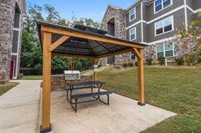 Columbus apartment for rent - a patio with a picnic table and a gazebo