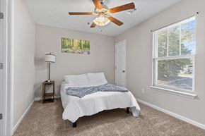 Columbus apartment for rent - a bedroom with a bed and a ceiling fan