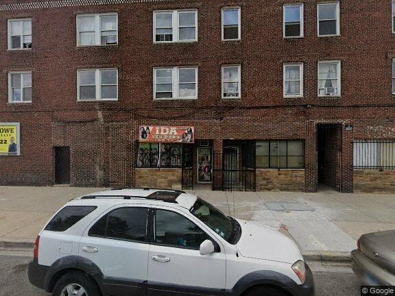 Chicago apartment for rent - a white car parked in front of a brick building