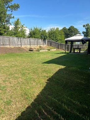 Rome house for rent - a backyard with a gazebo and a fence