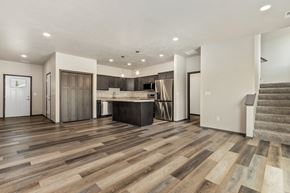 Sioux Falls apartment for rent - A spacious living room with a staircase on the right side.