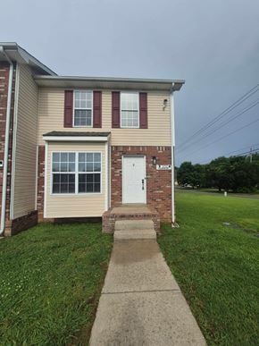 Oak Grove house for rent - A house with a red door and a window with red shutters.