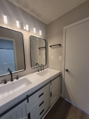 Oak Grove house for rent - A bathroom with a white sink and a mirror above it.